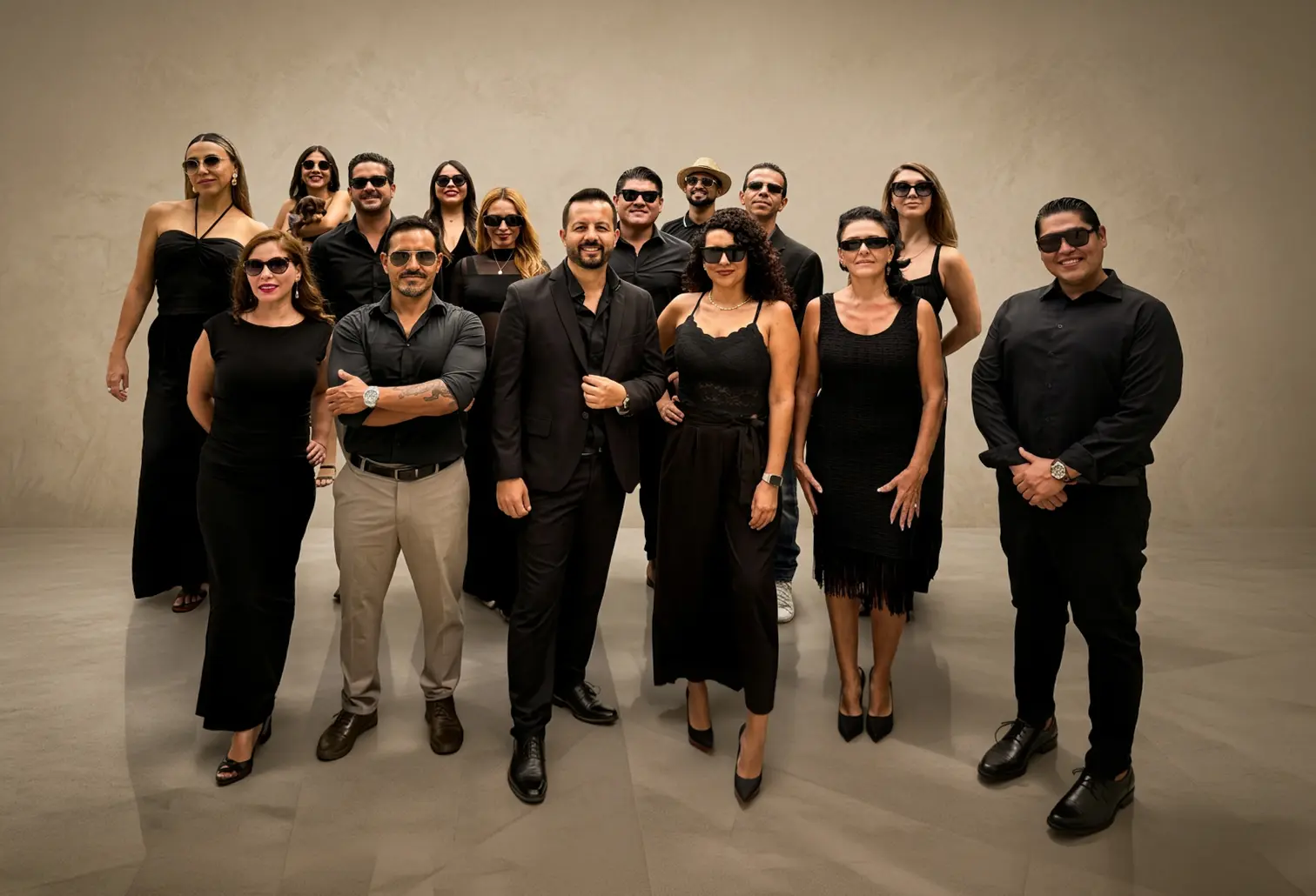 The 22 Latitud365 brokers together in black attire